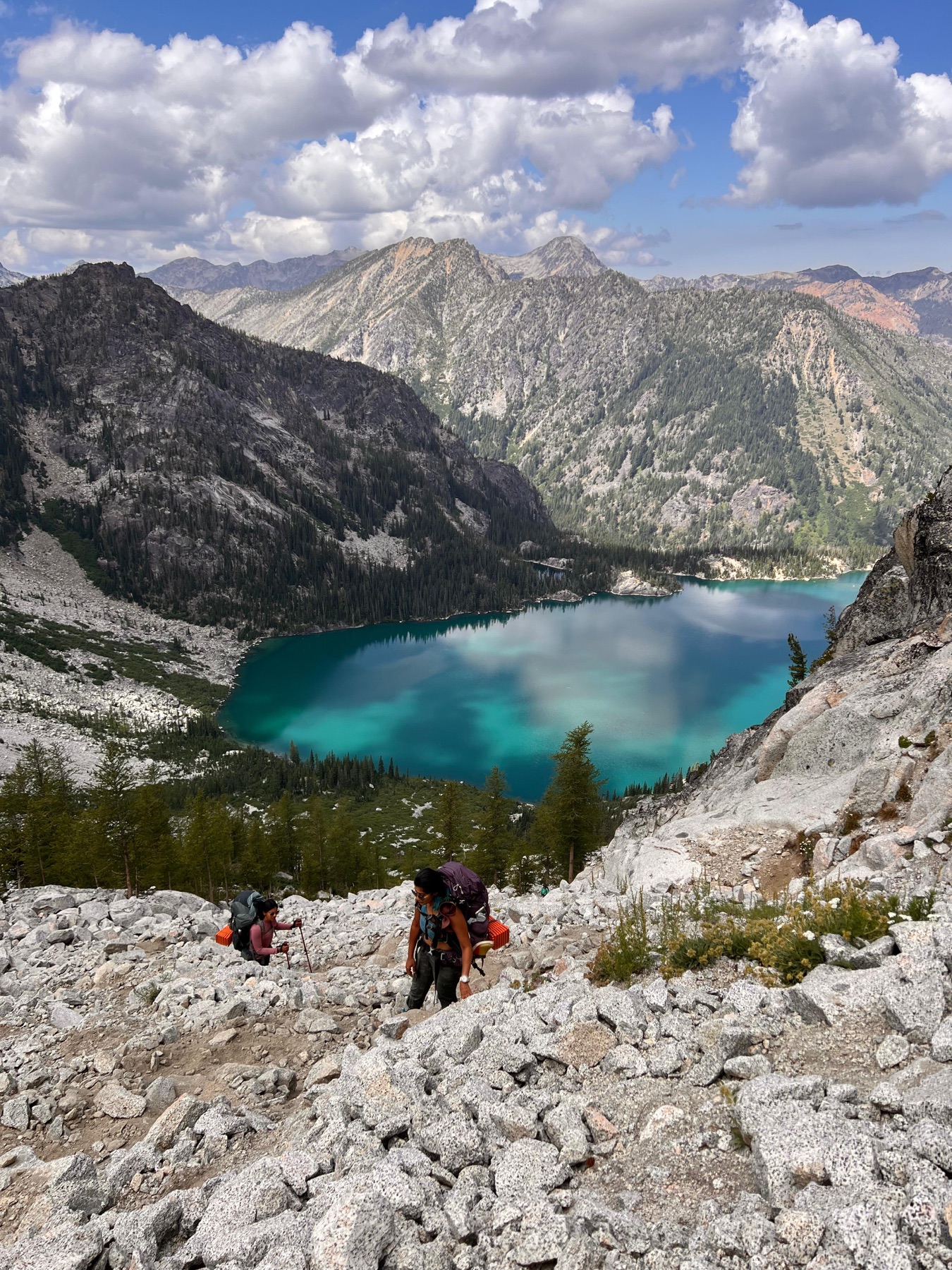 Hikers climbing Aasgard Pass above Colchuck Lake
