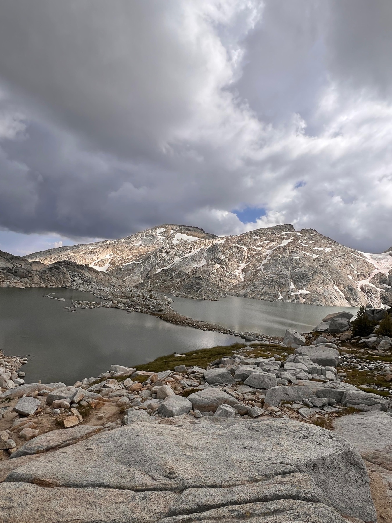 Alpine lake in the Core Zone under storm clouds